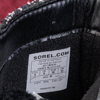 Sorel brand label on the inside of a black shoe